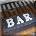 D18. Bar sign. 